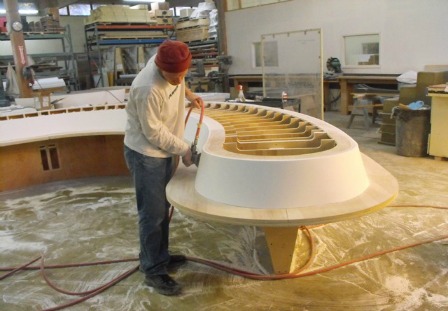 Figure 6 – Creating a set of thermoformed solid surface benches was another aspect to the project. The wooden support structure was used to mold the material.