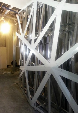 Figure 4 – To install the wall cladding, the metal substructure first had to be installed to mimic the shape of the finished project. Photo by Mike McGrath